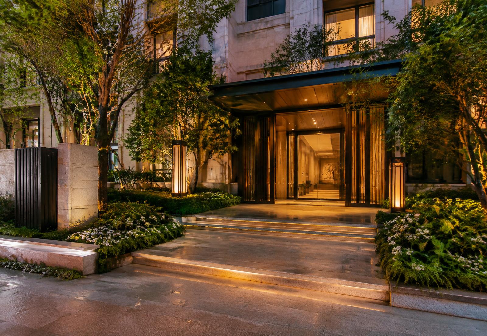 Landscaped residential entrance at dusk